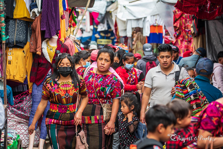 A group of shoppers in colourful traditional dress at Chichicastenango market in Guatemala