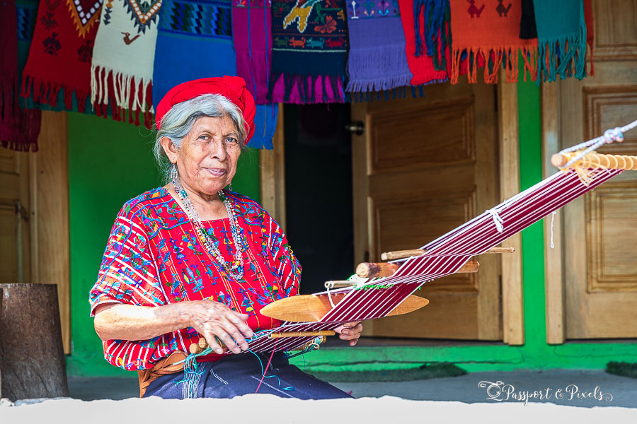 A woman doing backstrap loom weaving, an important tradition in Guatemala