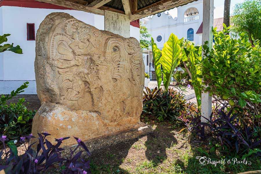 Carved ancient Maya stela in the main square in Flores in Guatemala