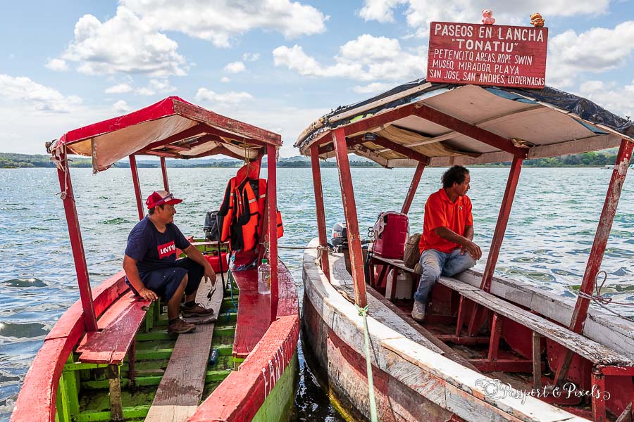 Boatmen wait for customers on Lake Peten Itza, Flores, Guatemala
