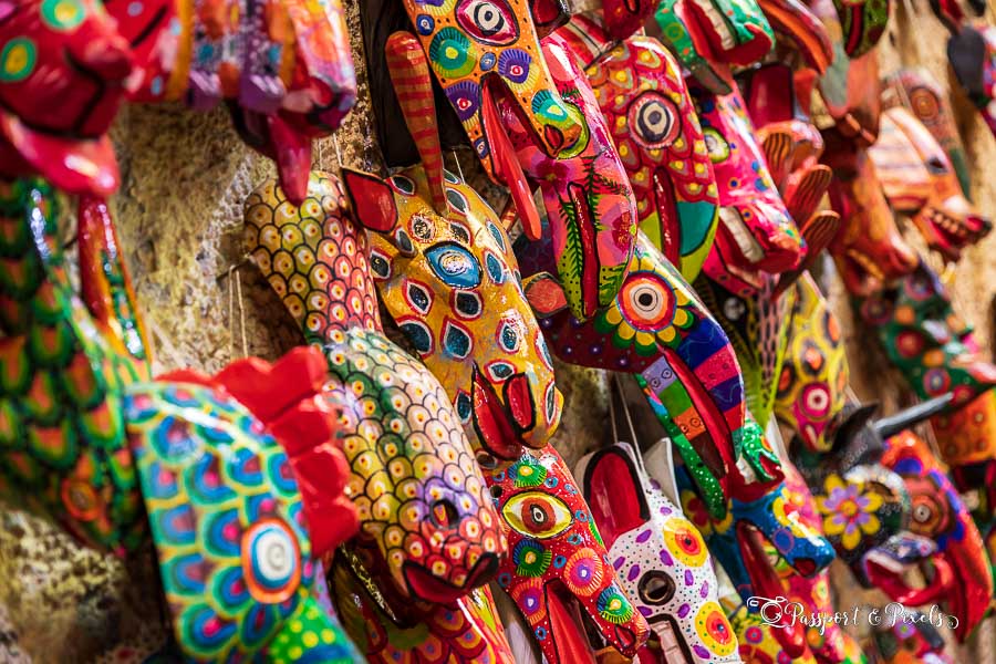 Colourful wooden masks on sale in the Nim Po’t handicrafts market hall