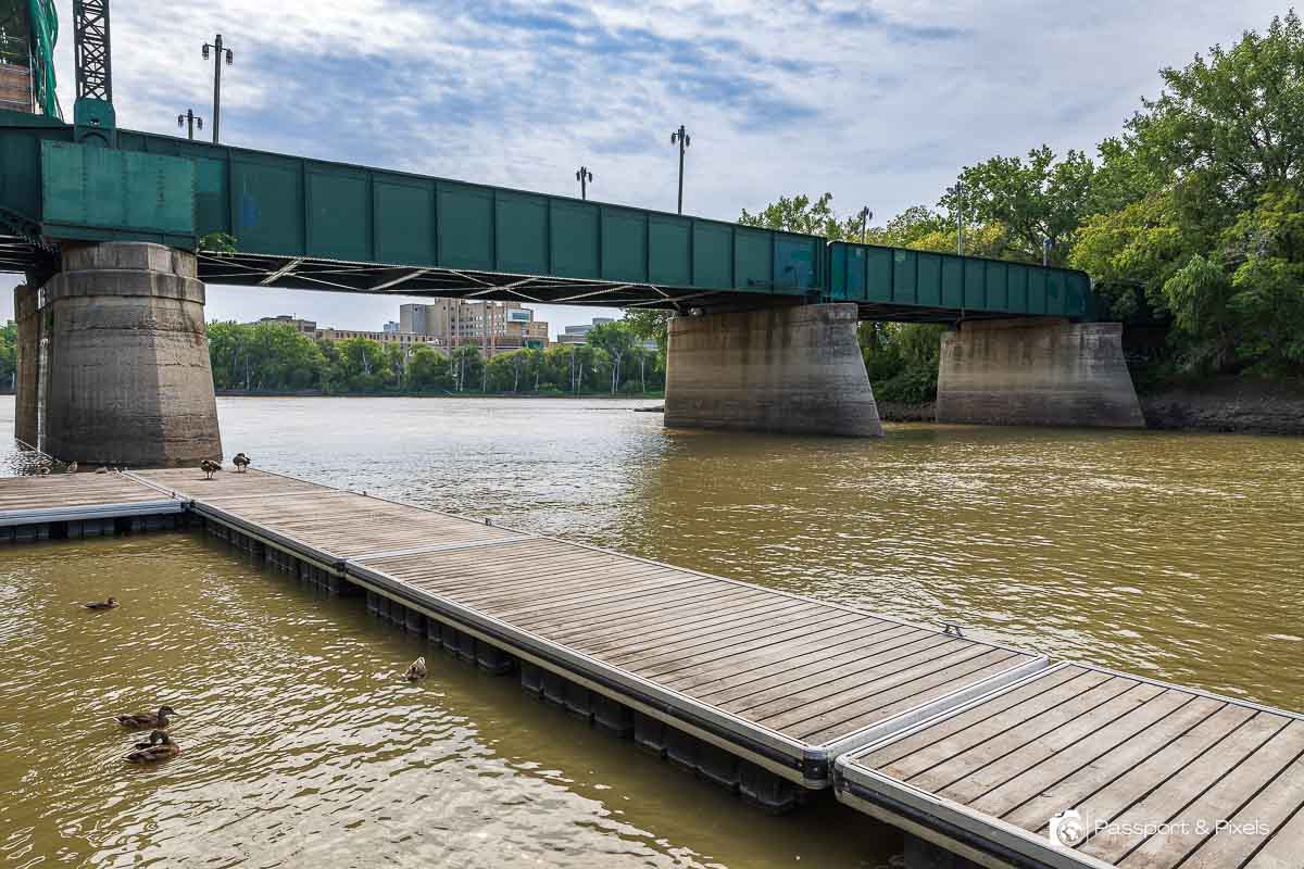 See the muddy waters where the Red and Assiniboine Rivers meet on your Winnipeg itinerary