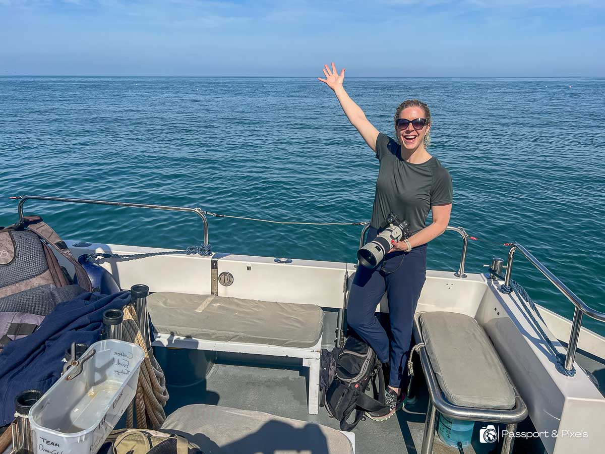 Me, the author, on a boat in Cardigan Bay, Wales, looking out for dolphins and other wildlife